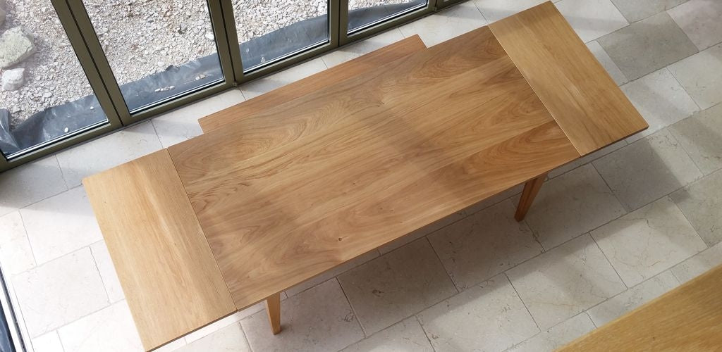 Bespoke extending dining table handmade in British Prime Oak