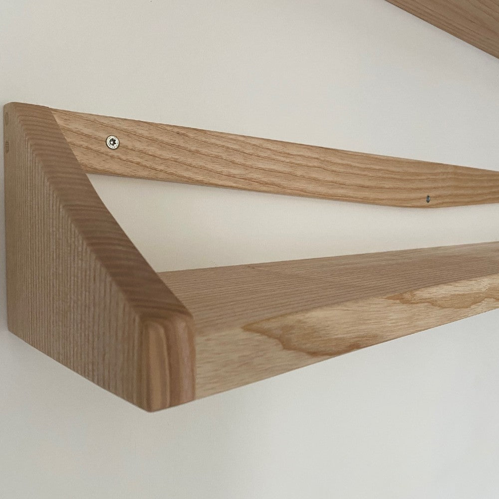 Close up of British Ash handmade book shelf with ends and back plate