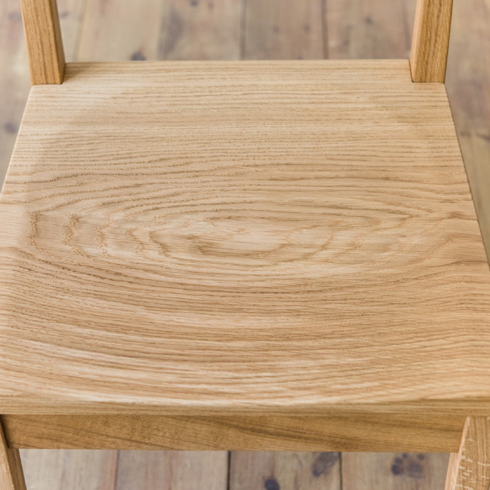 Chair seat of our Brampton low back in prime oak with clear oiled finish