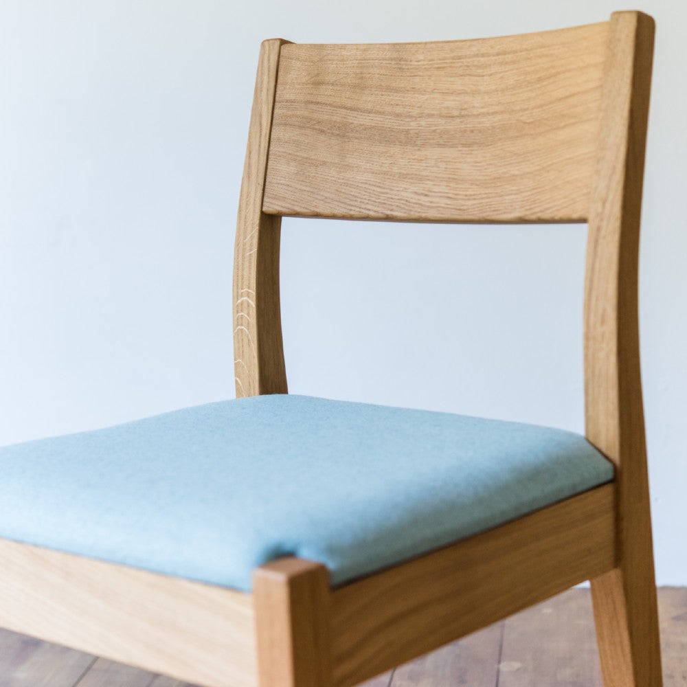 Front of the Brampton upholstered chair in prime oak with clear oiled finish