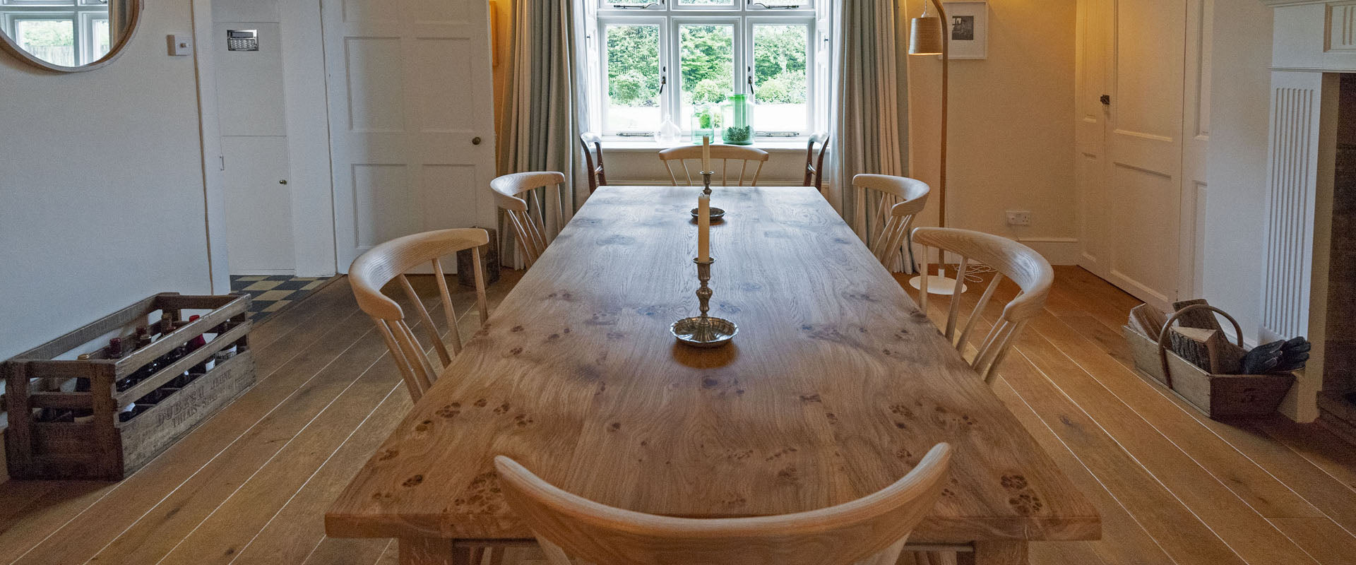 bespoke furniture made by orpago furniture in south devon. Dining room table set in county style farmhouse with chairs mirror and lighting