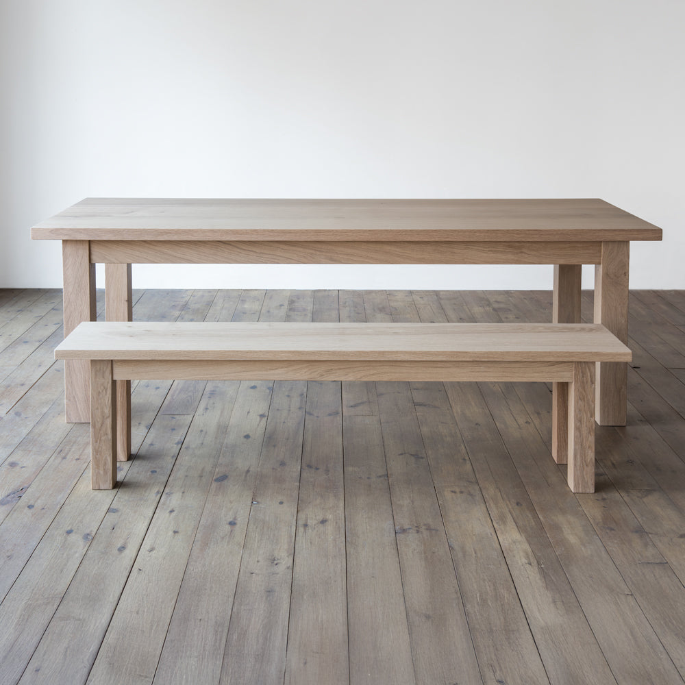side view of orpago hand made bespoke avon bench made from british prime oak and a raw oiled finish with an orpago avon table
