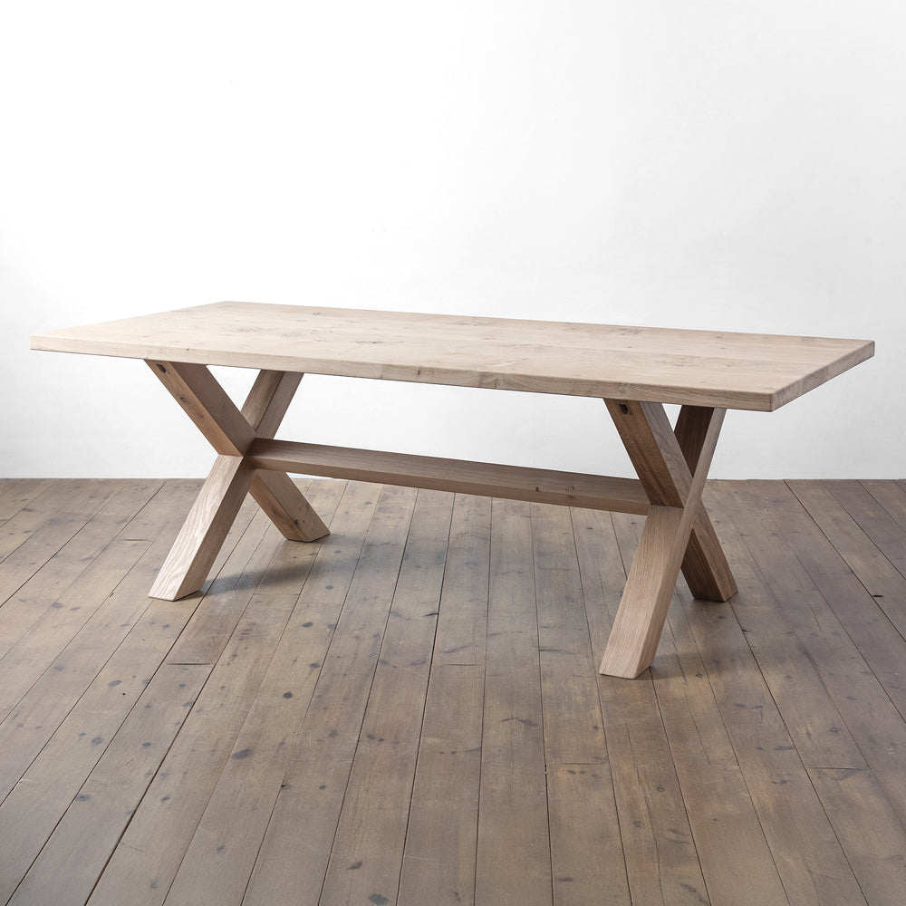 side view of orpago hand made bespoke clawcross kitchen dining table made from british clawcross pippy oak with a raw oiled finish