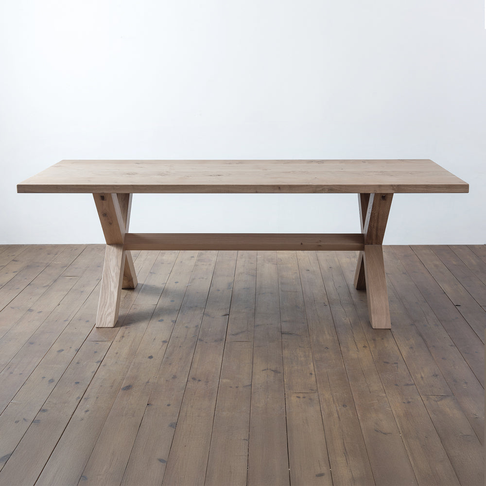 front view of orpago hand made bespoke clawcross kitchen dining table made from british clawcross pippy oak with a raw oiled finish