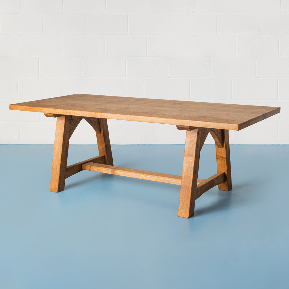 side view of orpago hand made bespoke savernake kitchen dining table made from british oak with distressed edges and a gazelle oiled finish