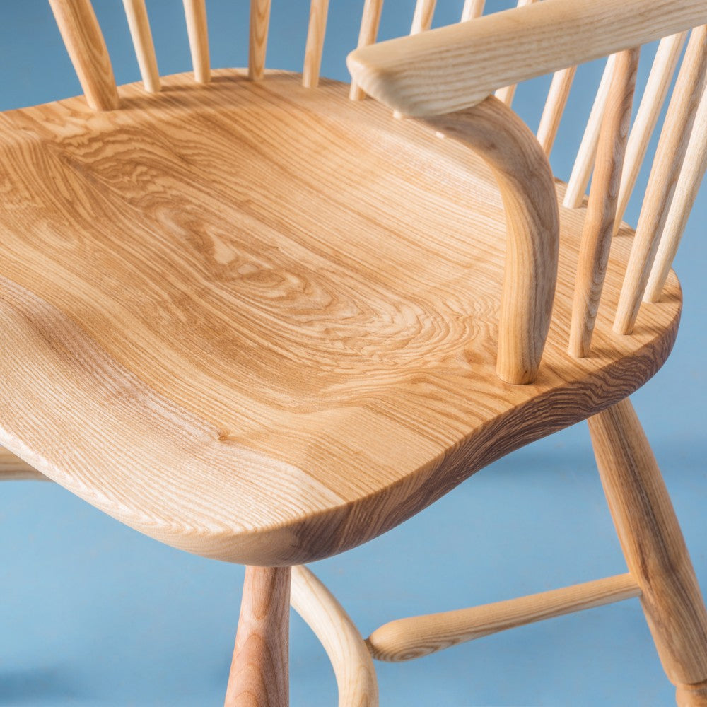 Close up of the chair seat and steam bent arm on our Richmond armchair in ash with a clear satin oiled finish