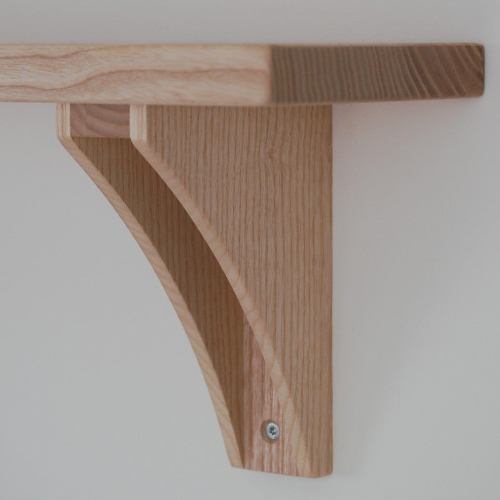 close up of side profile of wooden bracket in british ash